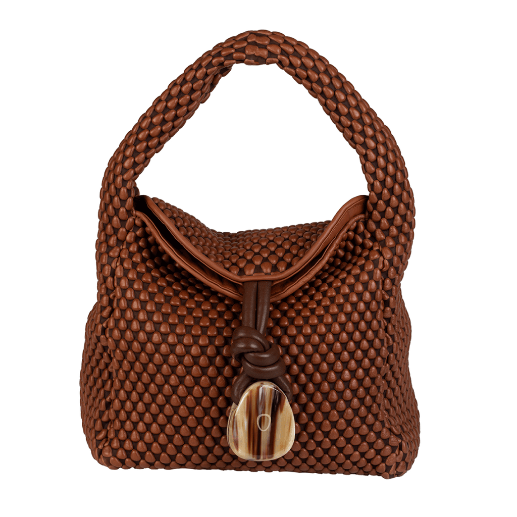 A foldover leather handbag with horn detailing. Perfect for an everyday bag. Made of Spanish Nappa Leather