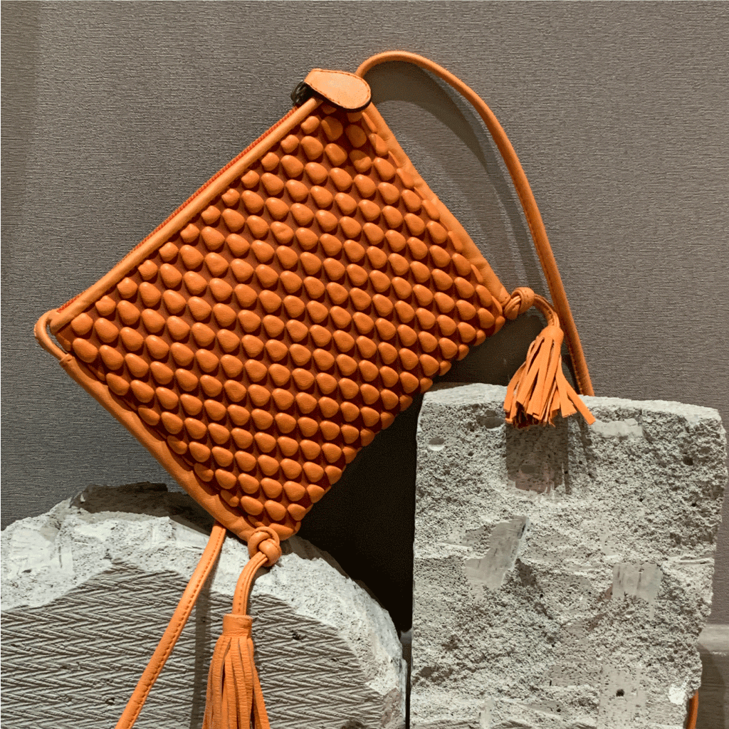 A Spanish Nappa Leather fun crossbody bag to hold your basics in a bright orange