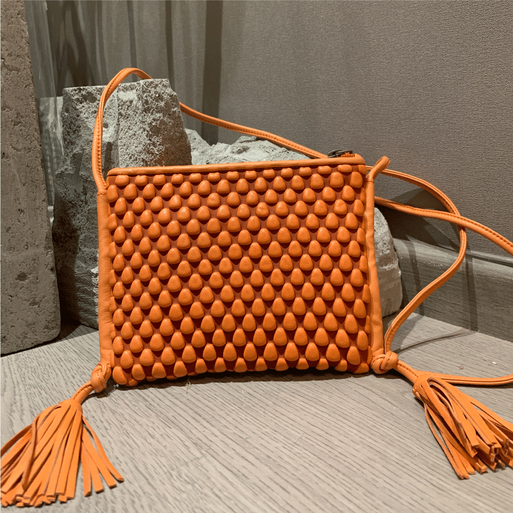 A Spanish Nappa Leather fun crossbody bag to hold your basics in a bright orange