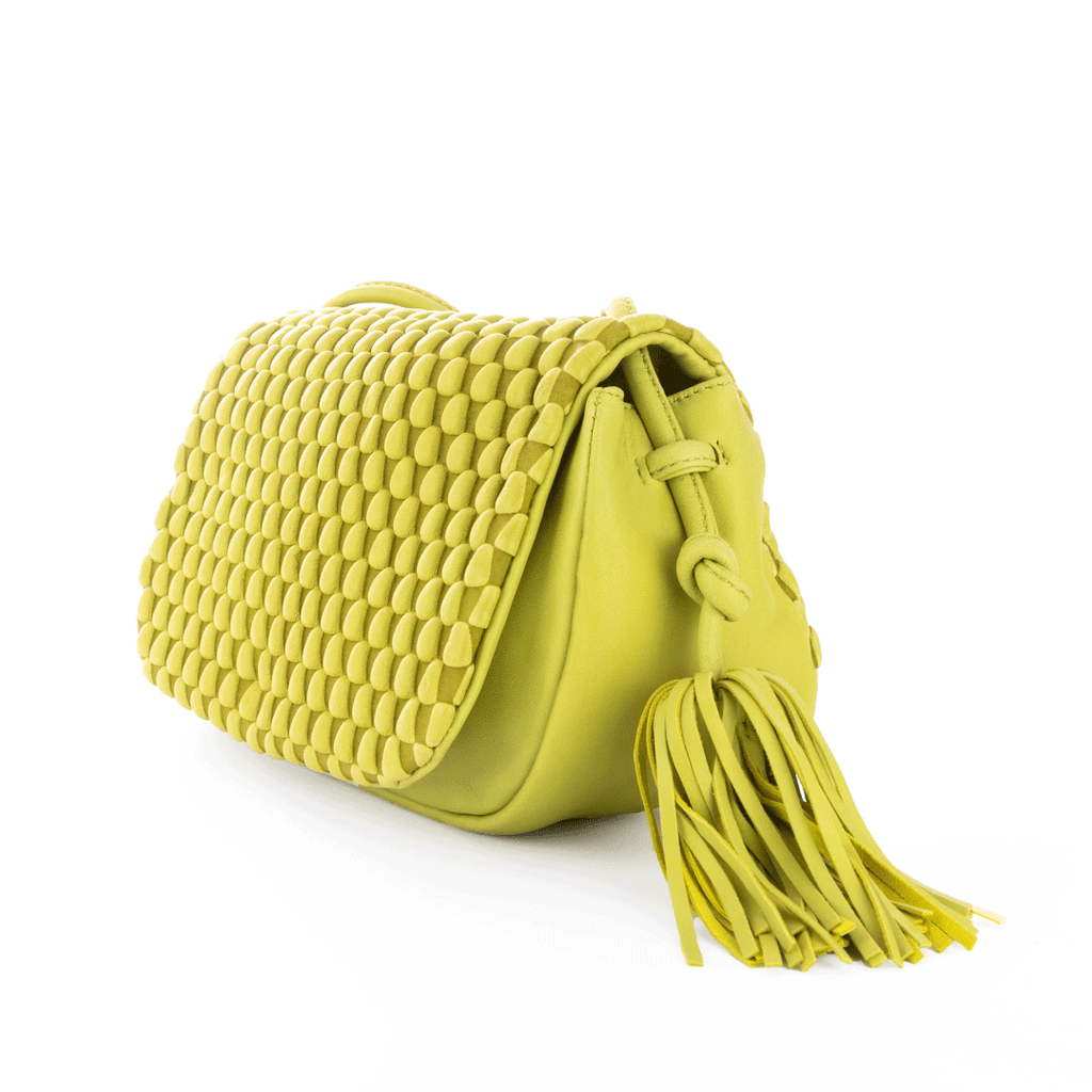 A flapover luxury leather bags with tassle detailing. This can be used as a crossbody for day and evening as a clutch. Made of Spanish Nappa Leather