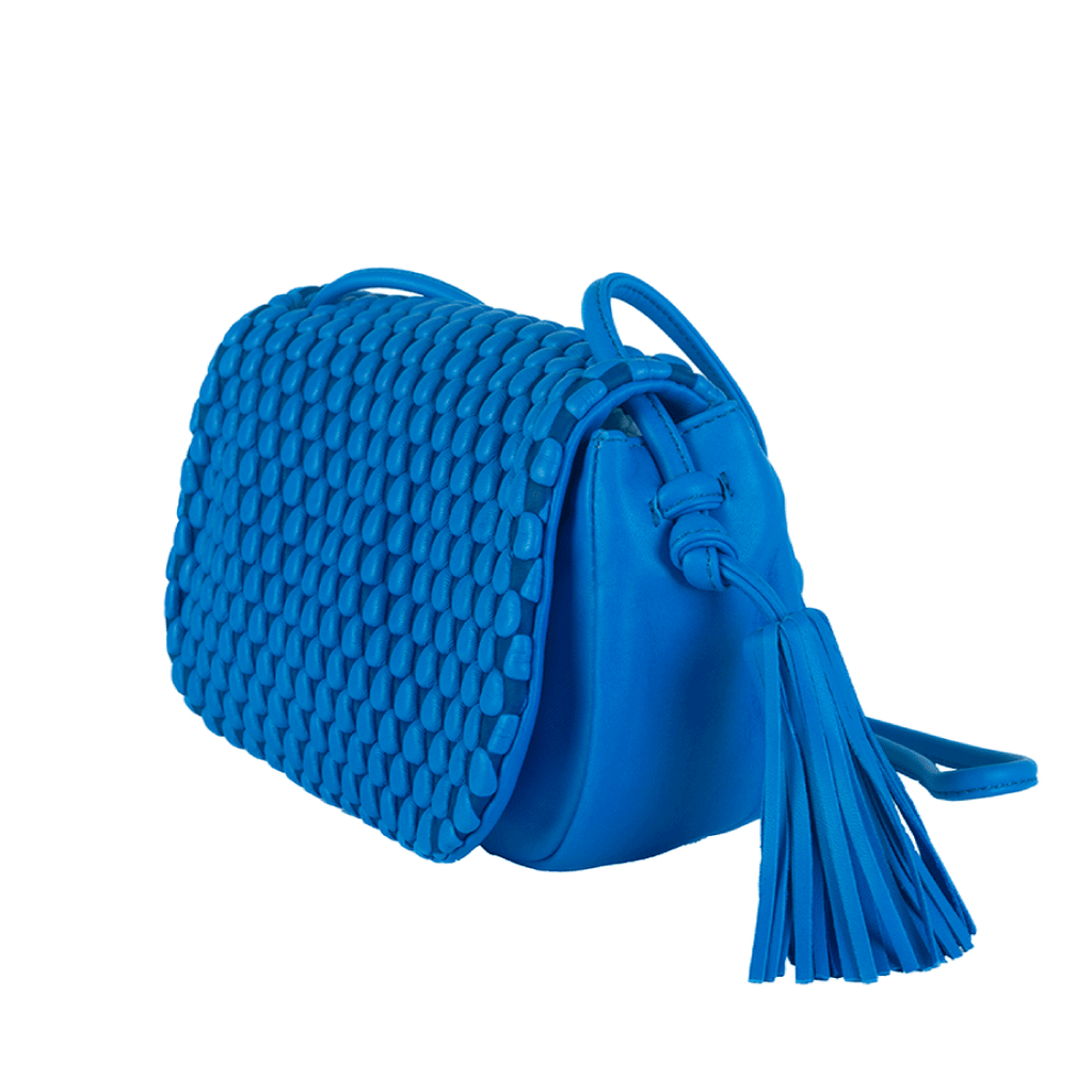 A flapover luxury leather bags with tassle detailing. This can be used as a crossbody for day and evening as a clutch. Made of Spanish Nappa Leather