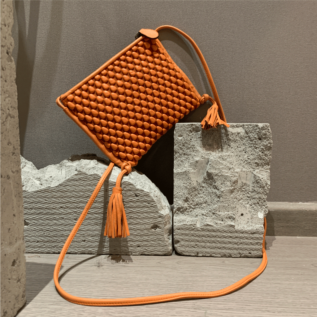 A Spanish Nappa Leather fun crossbody bag to hold your basics in a bright orange