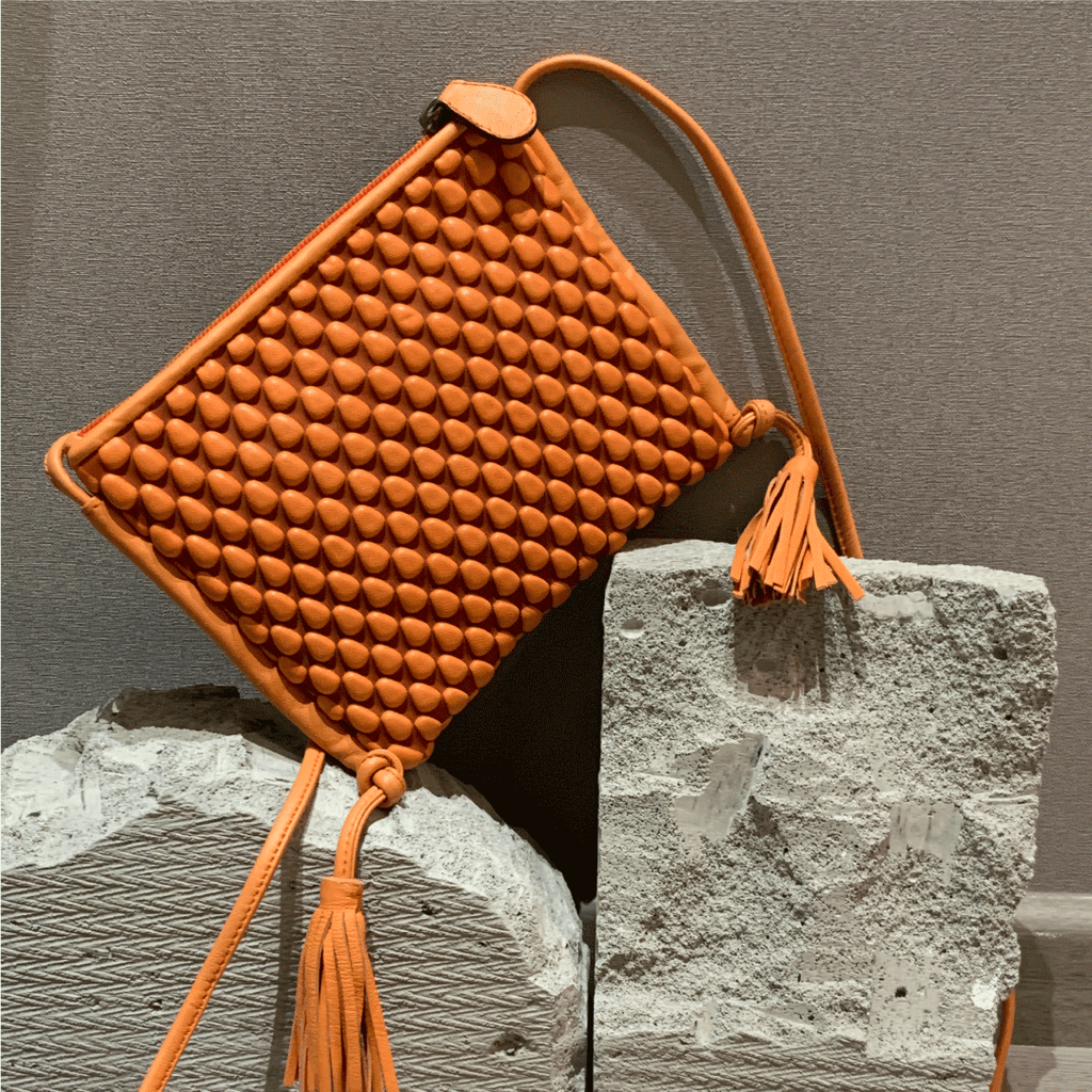 A Spanish Nappa Leather fun crossbody bag to hold your basics in a bright orange